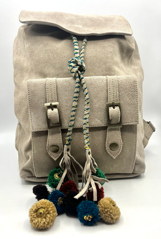 Tan Suede Backpack with colorful Pom Pom Tassle.